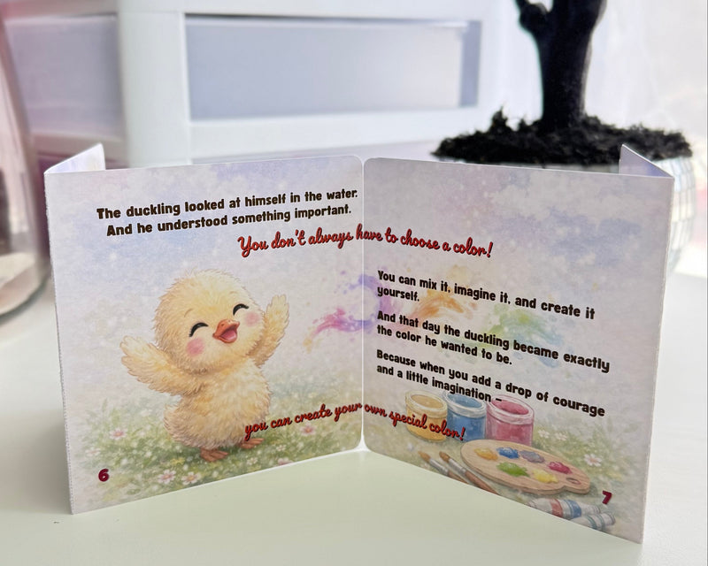 Open card with cartoon character and text on a white surface